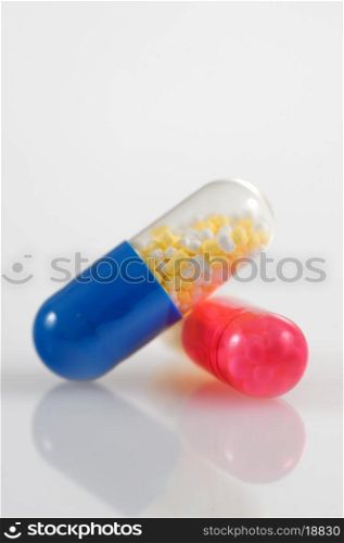 Medicine pills over white background