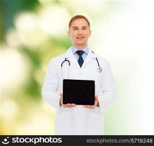 medicine, profession, advertisement and nature concept - smiling male doctor showing tablet pc computer screen over natural background