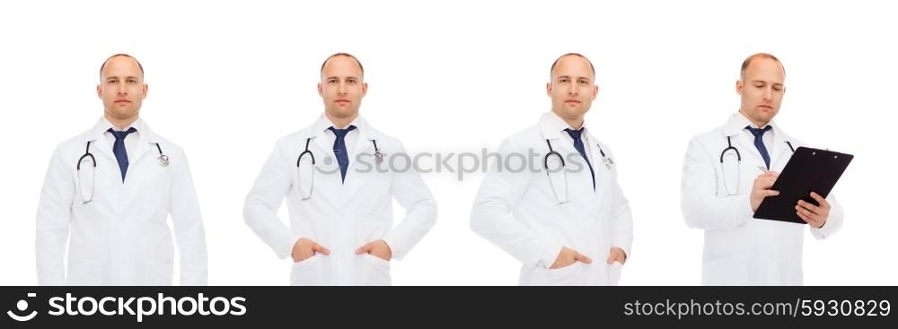 medicine, profession and health care concept - happy doctors with clipboard and stethoscope