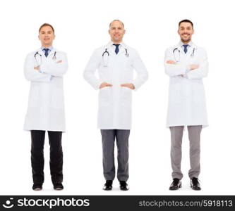 medicine, profession and health care concept - happy doctors with stethoscope