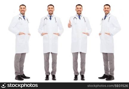 medicine, profession and health care concept - happy doctors with stethoscope showing thumbs up