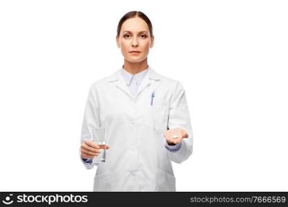 medicine, profession and healthcare concept - female doctor with pill and glass of water over white background. doctor with medicine and glass of water