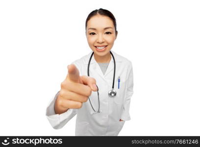 medicine, profession and healthcare concept - happy smiling asian female doctor with stethoscope in white coat pointing to camera. happy asian female doctor pointing to camera