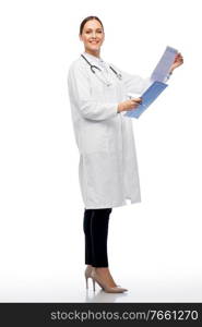 medicine, profession and healthcare concept - happy smiling female doctor in white coat with clipboard and pen. happy smiling female doctor with clipboard