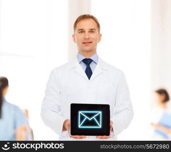 medicine, profession, and healthcare concept - smiling male doctor showing tablet pc computer screen over blue background