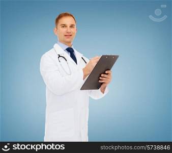 medicine, profession and healthcare concept - smiling male doctor with clipboard and stethoscope writing prescription over blue background