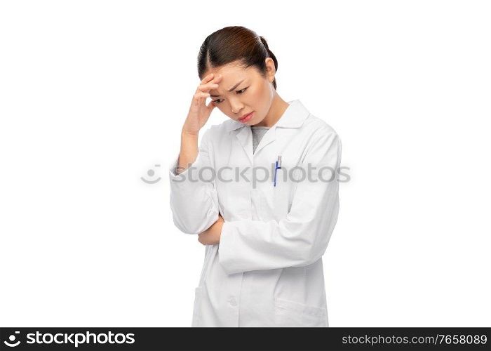 medicine, profession and healthcare concept - unhappy thinking asian female doctor in white coat. sad thinking asian female doctor in white coat