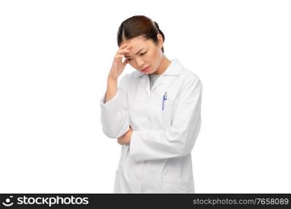 medicine, profession and healthcare concept - unhappy thinking asian female doctor in white coat. sad thinking asian female doctor in white coat