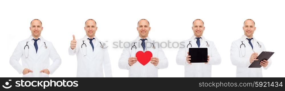 medicine, profession, cardiology and health care concept - doctors with red heart, tablet pc and clipboard