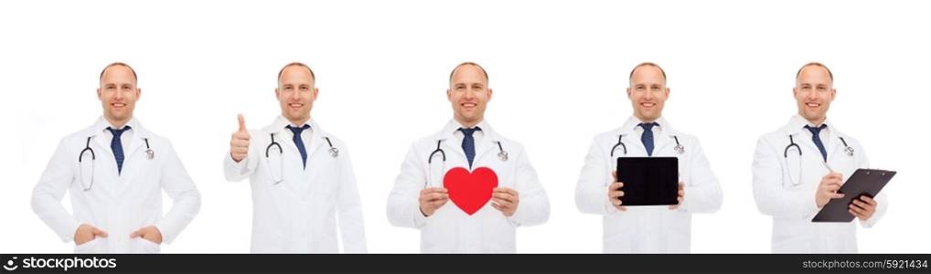 medicine, profession, cardiology and health care concept - doctors with red heart, tablet pc and clipboard