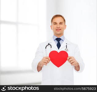 medicine, profession, charity and healthcare concept - smiling male doctor with red heart and stethoscope over white room background