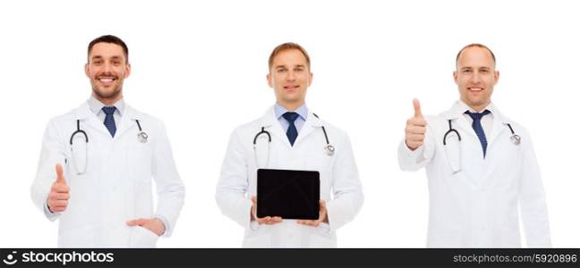 medicine, profession, technology and health care concept - happy doctors with tablet pc showing thumbs up