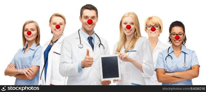 medicine, red nose day and healthcare concept - international group of smiling medics or doctors with tablet pc computer over white background. young doctors holding tablet pc in hands
