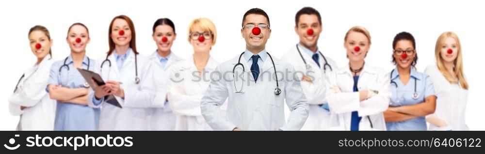 medicine, red nose day and healthcare concept - international group of smiling medics or doctors over white background. group of smiling doctors at red nose day