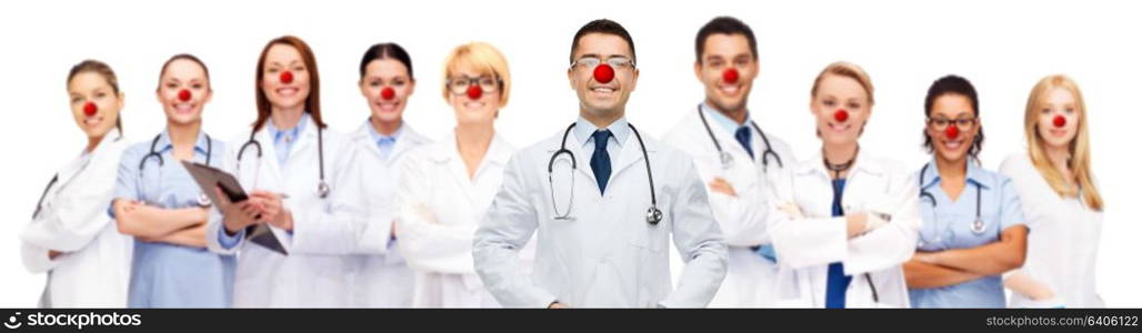 medicine, red nose day and healthcare concept - international group of smiling medics or doctors over white background. group of smiling doctors at red nose day