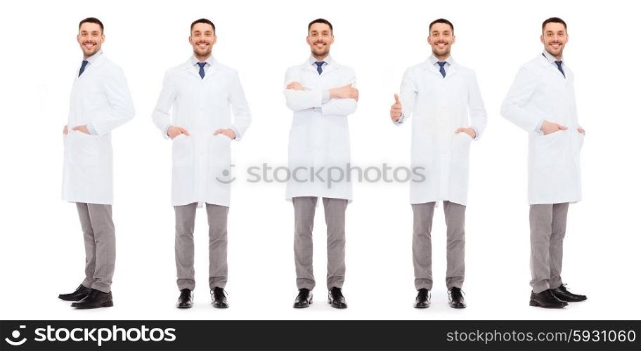 medicine, science, profession and health care concept - happy doctors with stethoscope showing thumbs up