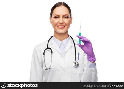 medicine, vaccination and healthcare concept - happy smiling female doctor with stethoscope and syringe over white background. smiling female doctor with medicine in syringe