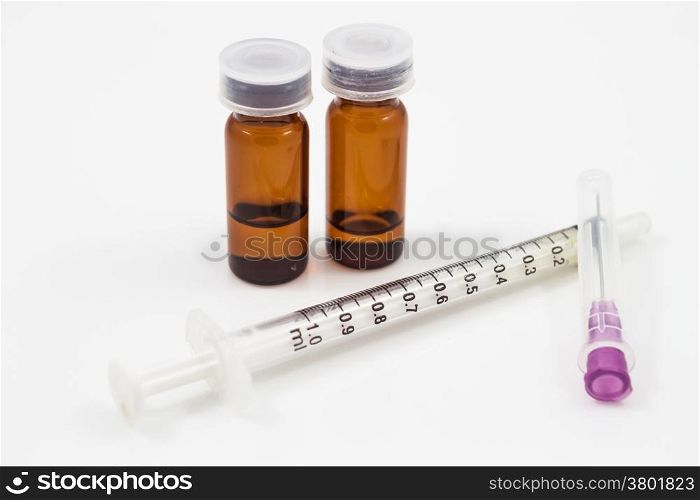 Medicine vials and syringe isolated on white background, stock photo