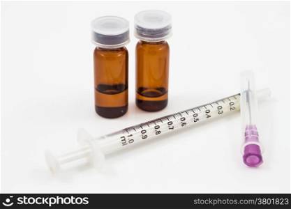 Medicine vials and syringe isolated on white background, stock photo