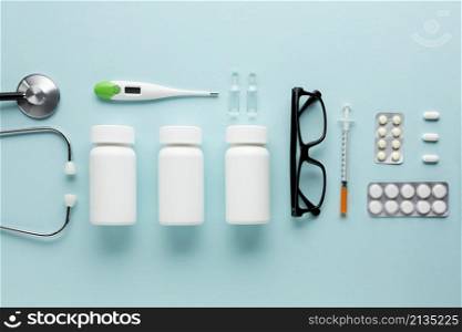 medicines healthcare accessories arranged blue surface