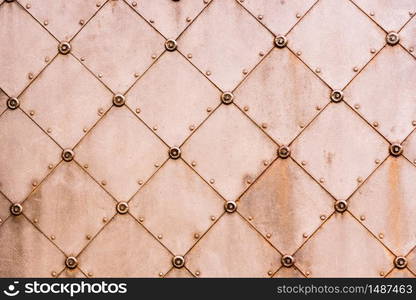 Medieaval pattern on an old metal door. Abstract texture.. Medieaval pattern on an old metal door.