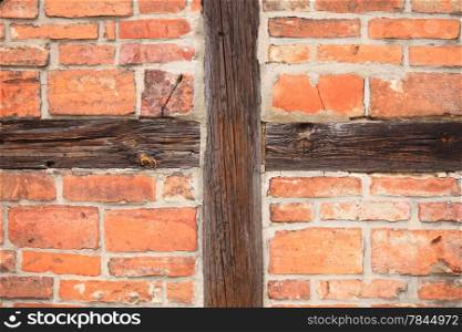 Medieval brick and half-timbered house in Gdansk, Danzig Poland. Background of beams and bricks. Detail of the exterior old building.