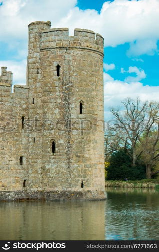 Medieval castle tower surrounded by moat