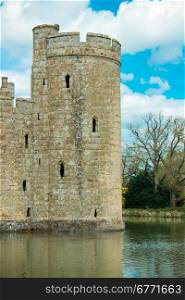 Medieval castle tower surrounded by moat