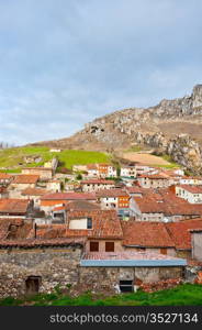 Medieval City on the Background of Rocky Mountains