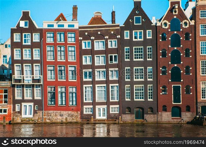 Medieval cute houses in Amsterdam the Netherlands. Traditional dutch medieval houses in Amsterdam capital of Netherlands