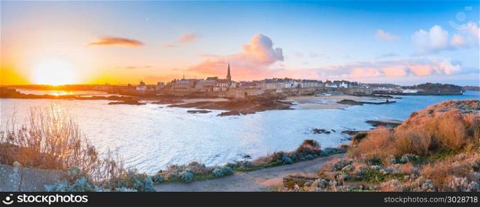 Medieval fortress Saint-Malo, Brittany, France. Panoramic view of walled city Saint-Malo with St Vincent Cathedral at sunrise. Saint-Maol is famous port city of Privateers is known as city corsaire, Brittany, France