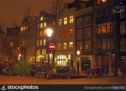 Medieval houses in Amsterdam at night in the Netherlands