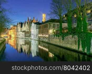 Medieval houses on the green channel. Brugge. Belgium. Bruges. Green canal.
