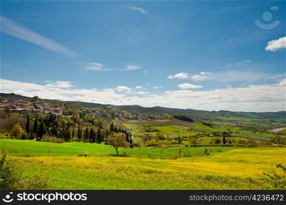 Medieval Italian Town Surrounded by Fields and Mountains