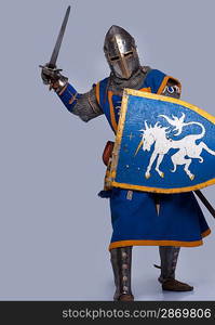 Medieval knight on grey background.