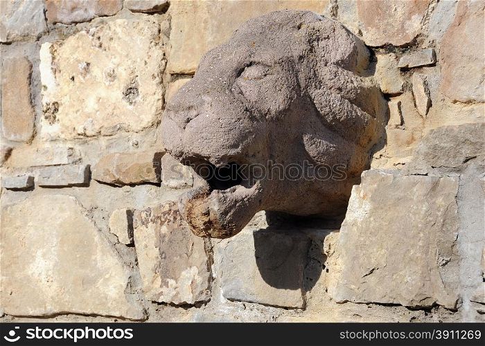 Medieval lion bass-relief on the stone wall in the town of Veliko Tarnovo in Bulgaria