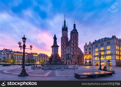 Medieval Main market square with Basilica of Saint Mary at gorgeous sunrise in Old Town of Krakow, Poland. Main market square, Krakow, Poland