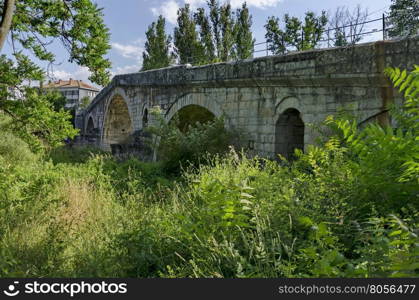 Medieval one hundred meter long stone Kadin bridge build over the river Struma, Nevestino village, Bulgaria