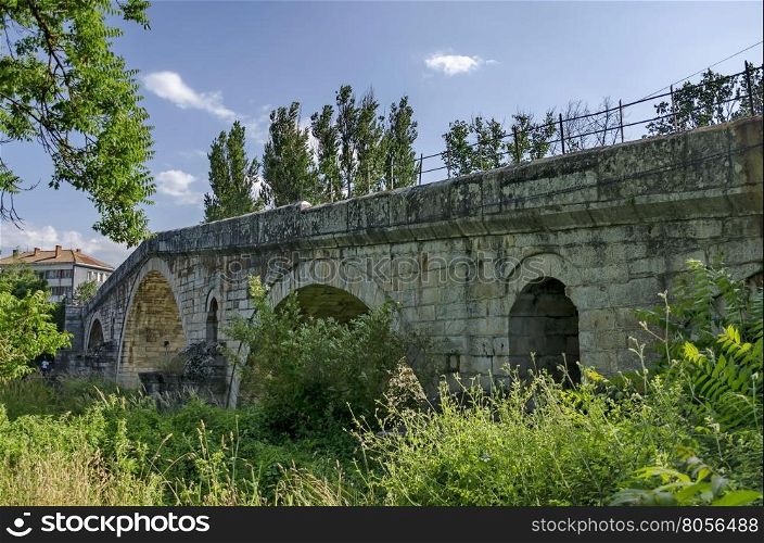 Medieval one hundred meter long stone Kadin bridge build over the river Struma, Nevestino village, Bulgaria