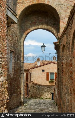 Medieval picturesque street and gate in Santarcangelo di Romagna town, Rimini Province, Italy