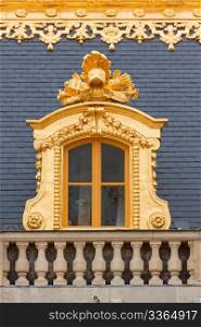 Medieval Royal Palace window in the golden frame.