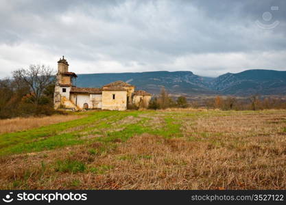 Medieval Spanish Church Surrounded by Fields in the Rainy Weather