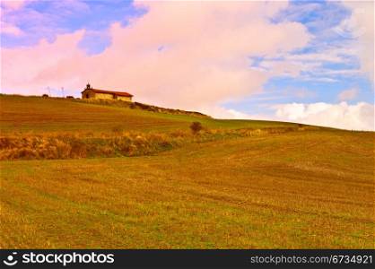 Medieval Spanish Church Surrounded by Fields, Sunset