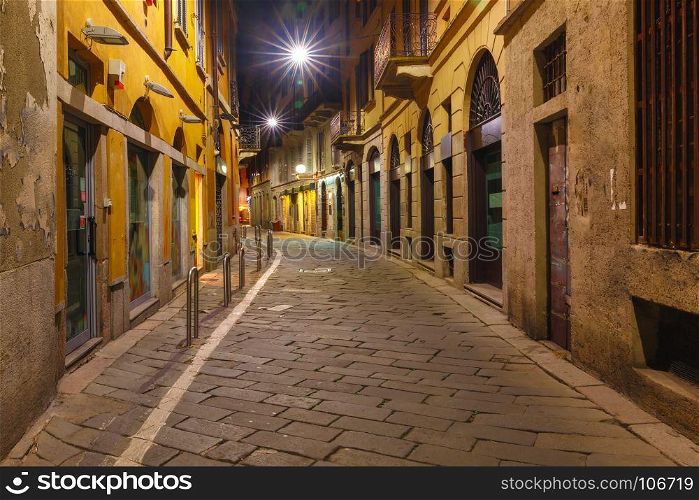 Medieval street at night in Milan, Lombardia, Italy. Typical Italian medieval street at night in the centre of the Old Town of Milan, Lombardia, Italy