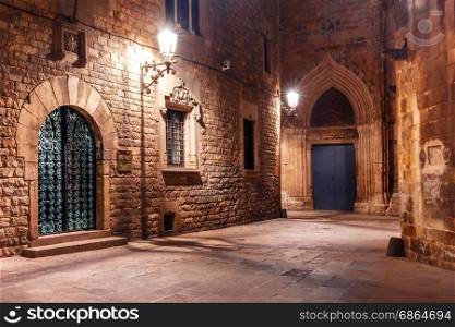 Medieval street in Barri Gothic Quarter, Barcelona. Cobbled empty medieval street in Barri Gothic Quarter at night, Barcelona, Catalonia, Spain