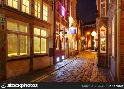 Medieval street Schnoor in Bremen, Germany. Medieval Bremen street Schnoor with half-timbered houses in the centre of the Hanseatic City of Bremen at night, Germany
