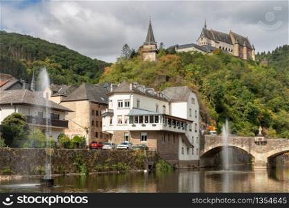 Medieval Vianden castle above valley and river Our in Luxembourg. Vianden castle above valley and river Our in Luxembourg