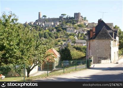 Medieval walls and towers at the top of a hill, Turenne, France