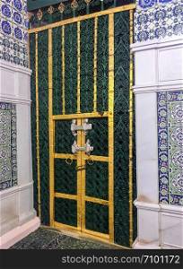 MEDINA, SAUDI ARABIA - JUNE 24, 2019: The tomb of the Islamic prophet Muhammad and tomb door on June 24, 2019 in Madinah, Saudi Arabia. His grave was designed in oriental style.