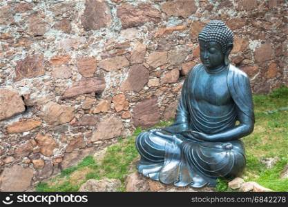 Meditating Buddha Statue, made of bronze. 19th Century, sitting stance, useful copyspace.